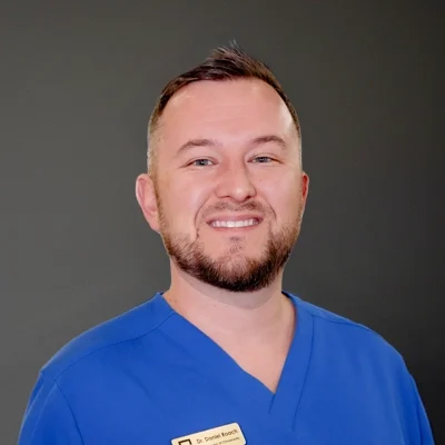 Chiropractor Daniel Roach Smiling Warmly Greeting Patients